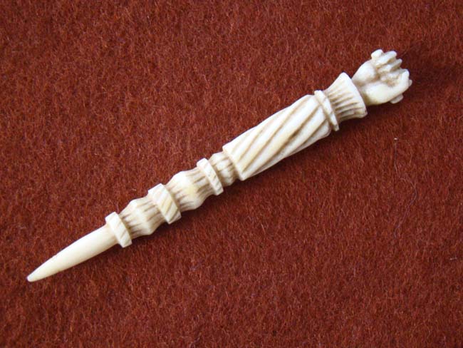 A fine 19th century sailor carved whalebone  BODKIN with clenched fist handle